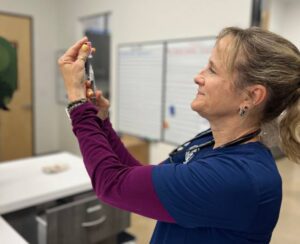 Nurse preparing injection Nurse preparing injection
