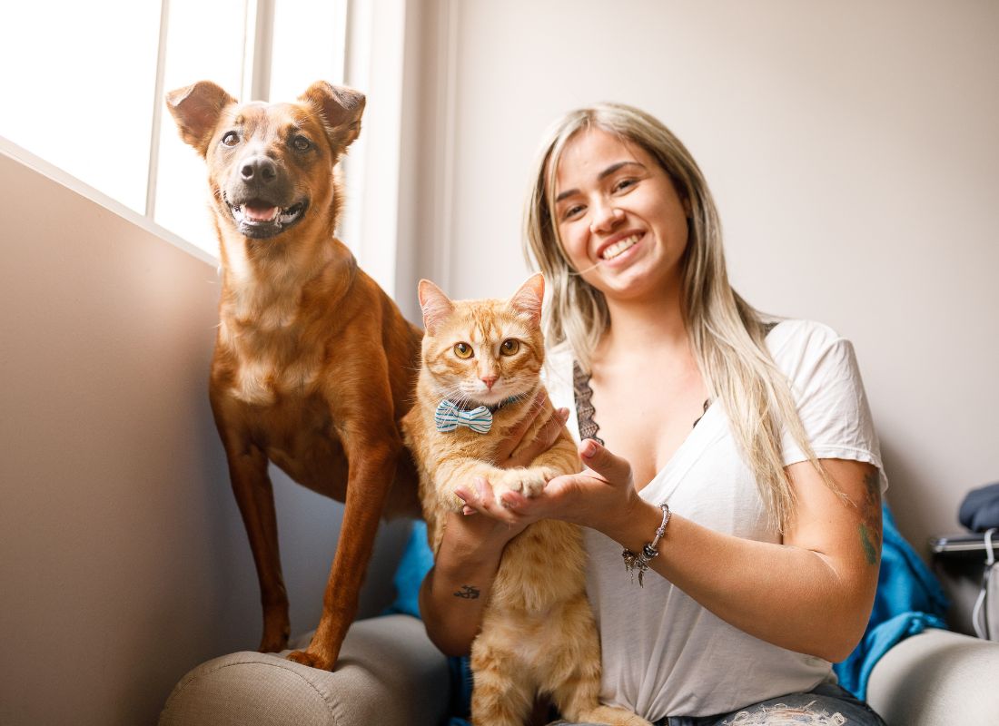 Woman, dog, cat smiling. Woman, dog, cat smiling.